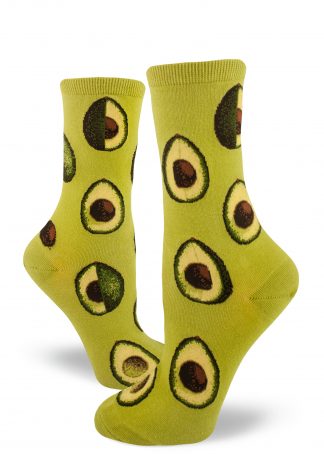 Avocados in various stages of being sliced make up the pattern on these green crew socks for women.