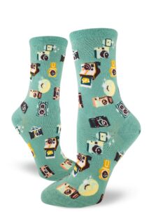 A pattern made from vintage cameras on turquoise women's crew socks.