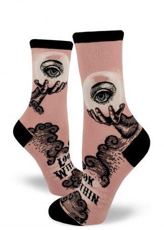 A hand holds a crystal ball with an eye above the words "Look Within" on dusty rose socks for women.