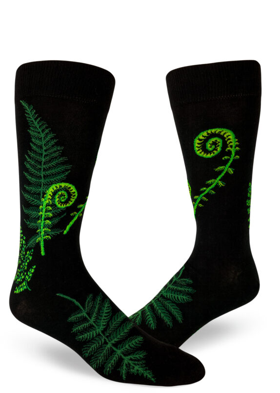 Ferns and fiddleheads nest on these black crew socks for men.