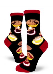 Pie socks with berry, cherry and lemon meringue pies on a black background with red accents.