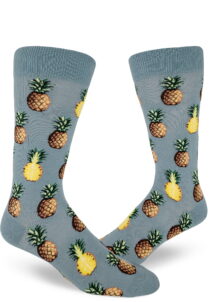 Pineapple fruit sit comfortably on these blue men's crew socks.