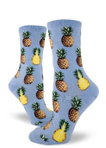 Pineapple fruit sit comfortably on these blue women's crew socks.