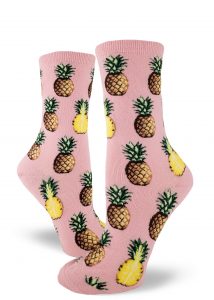 Pineapple fruit sit comfortably on these pink women's crew socks.