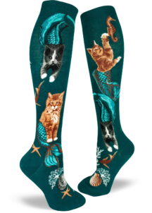 Purrmaid socks with cat mermaids swimming on a teal knee-high background.