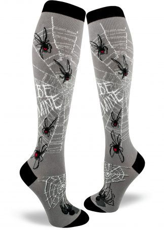 Spider socks for women with black widow spiders with red hearts on their abdomens standing on silver webs that say "BE MINE."