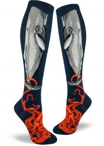 A giant squid battles a fleeing whale on these dark blue women's knee socks.