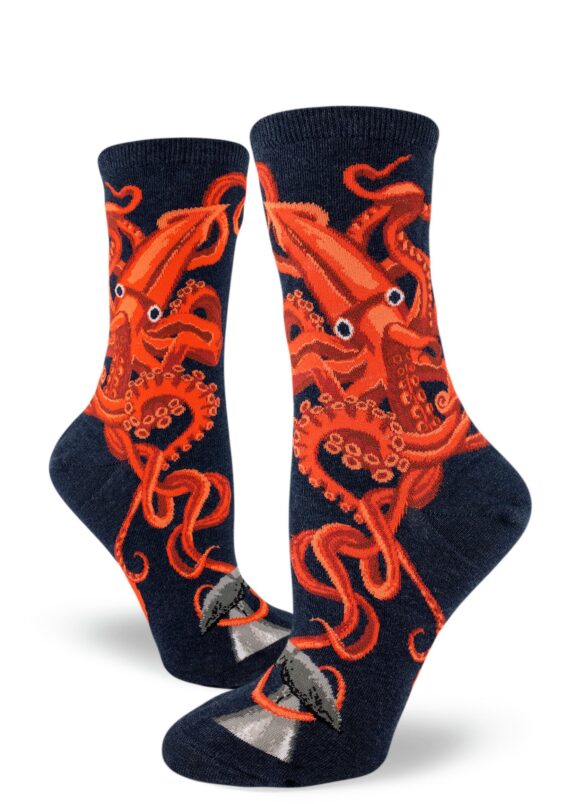 Squid socks depict a huge squid attacking a whale on a navy background.