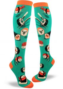 Sushi rolls and nigiri with happy faces play around with chopsticks and soy sauce on these aqua women's knee socks.