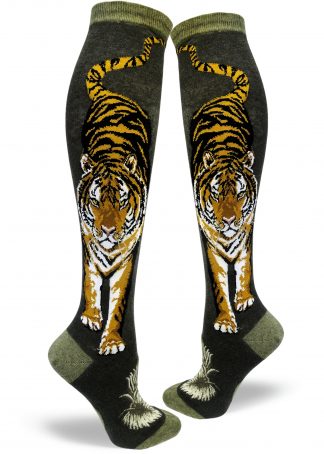 Tiger socks in knee high, with orange cats on earthy green, accented with jungle palm fronds.