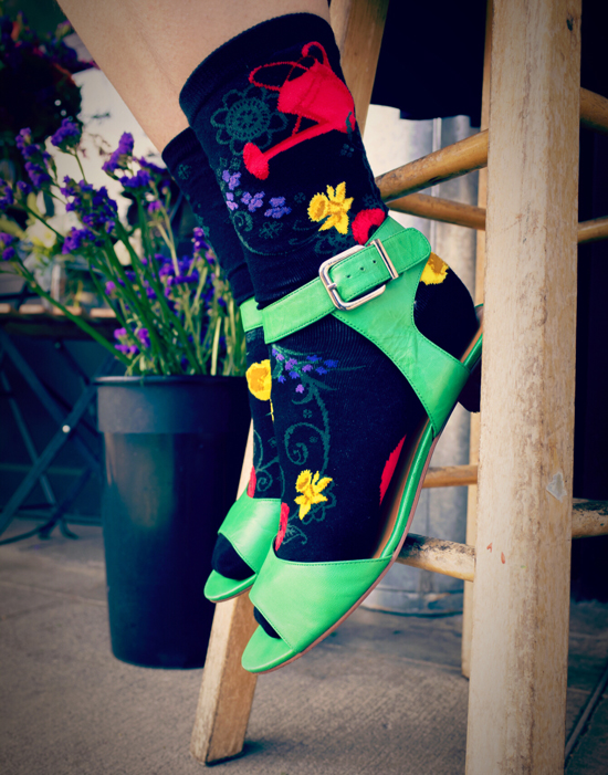 garden-goals-socks-modsocks-floral-sock-flower-socks Gardening socks with a red watering can pouring out a variety of flowers by ModSocks.