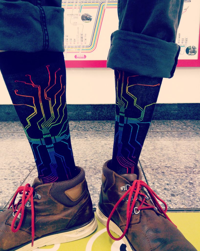 Motherboard socks for men by ModSocks worn in New York City subway style.