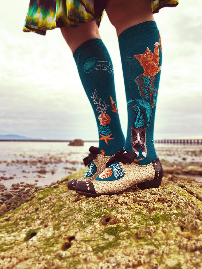 Cat mermaid socks aka purrmaid socks by ModSocks in teal on the beach.