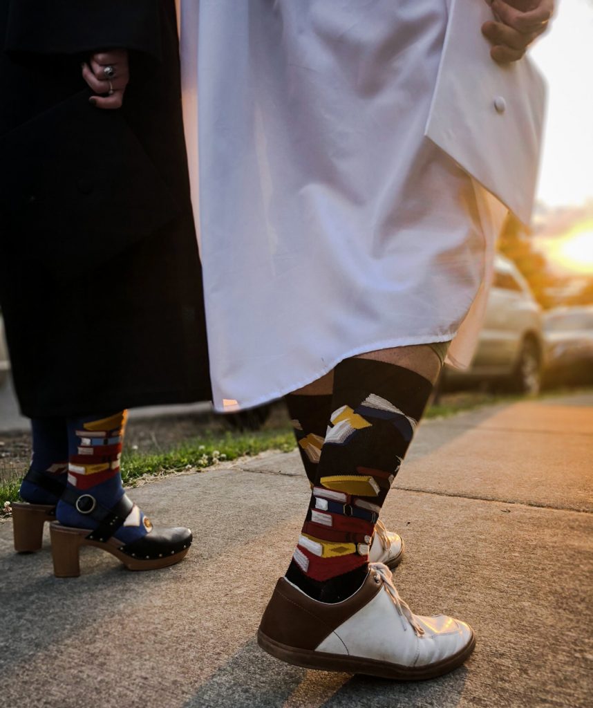 Book socks for men in black by ModSocks in graduation style.