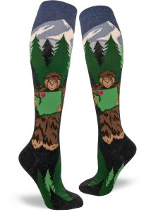 Sasquatch holds Washington State knee socks by ModSocks.