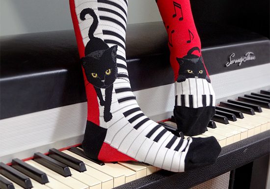 Piano cat socks by ModSocks in red knee high socks for pianists and cat lovers.