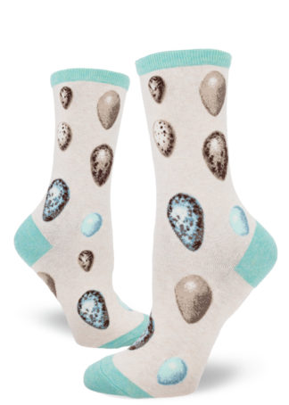 Heather cream women's crew socks with a pattern of various solid and speckled bird eggs in shades of aqua, taupe and brown.