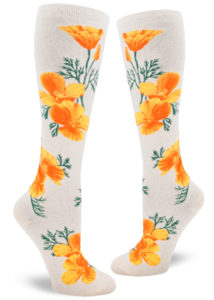 California poppy-themed floral knee socks, with bright orange flowers on a heather cream background.
