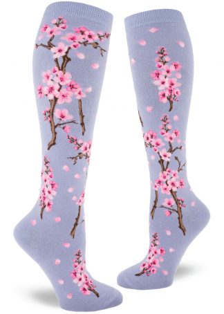 Cherry blossom knee socks with a pink floral design on a light violet background.