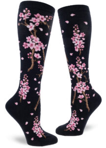 Cherry blossom knee socks with a pink floral design on a deep navy background.