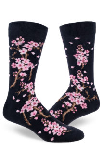 Men's cherry blossom socks with a pink floral design on a deep navy background.