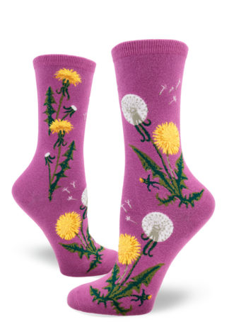 Dandelion crew socks with bright yellow flowers, white seed heads and green leaves on a magenta background.