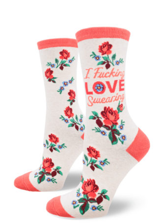Women's crew socks that say "I fucking love swearing" with a design of red roses and small blue flowers on a heather cream background.