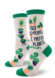 Funny crew socks that say "Fuck people, I prefer plants" with images of various houseplants.