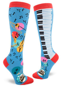 Blue knee socks accented in red feature a trombone, saxophone, trumpet, double bass, piano keys, music notes and a drum set that says "Jazz Band" on the bass drumhead.