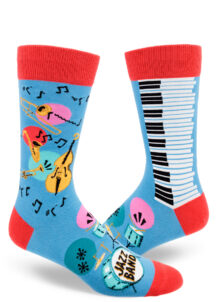 Blue men's crew socks accented in red feature a trombone, saxophone, trumpet, double bass, piano keys, music notes and a drum set that says "Jazz Band" on the bass drumhead.