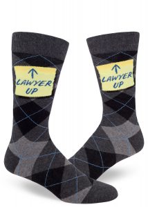 Men's argyle socks for lawyers with a sticky note that says "Lawyer Up."