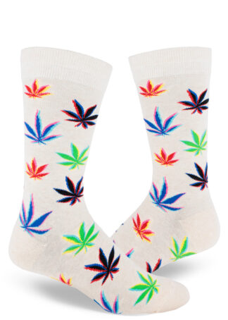 Men's crew socks with a colorful repeating glitch art marijuana leaf pattern over a heather cream background.
