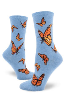 Women's crew socks with a vibrant monarch butterfly design on a blue background called "heather cornflower."