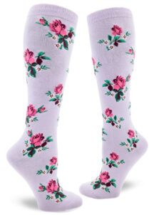 Floral knee socks with a pink rose motif accented by small blue flowers over a wisteria purple background.