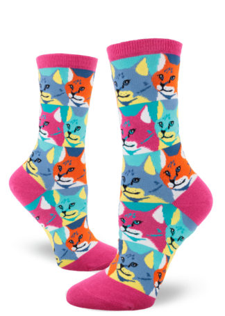 Colorful socks for women featuring a pop-art style repeating cat portrait pattern in magenta, orange, aqua, yellow, blue and white.