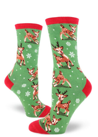 Red-accented green women's crew socks featuring a design of kitschy retro baby reindeer playing in a flurry of snowflakes.