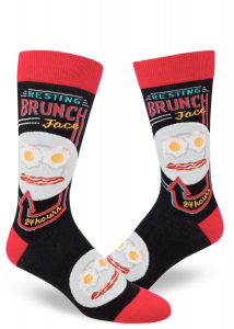 Black and red novelty socks say "Resting Brunch Face" and show a face made of eggs and bacon.