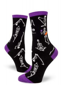 Socks depicting skeletons in yoga poses.