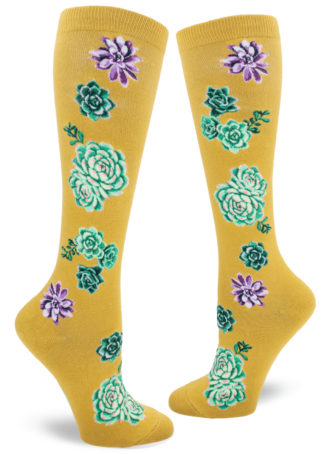 Knee socks with a design of green, purple and pink succulent plants on a chartreuse background.
