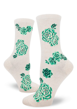 Women's crew socks with a design of green, purple and pink succulent plants on a heather cream background.