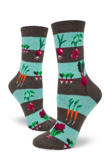 Striped socks in brown and aqua with a pattern of garden vegetables.